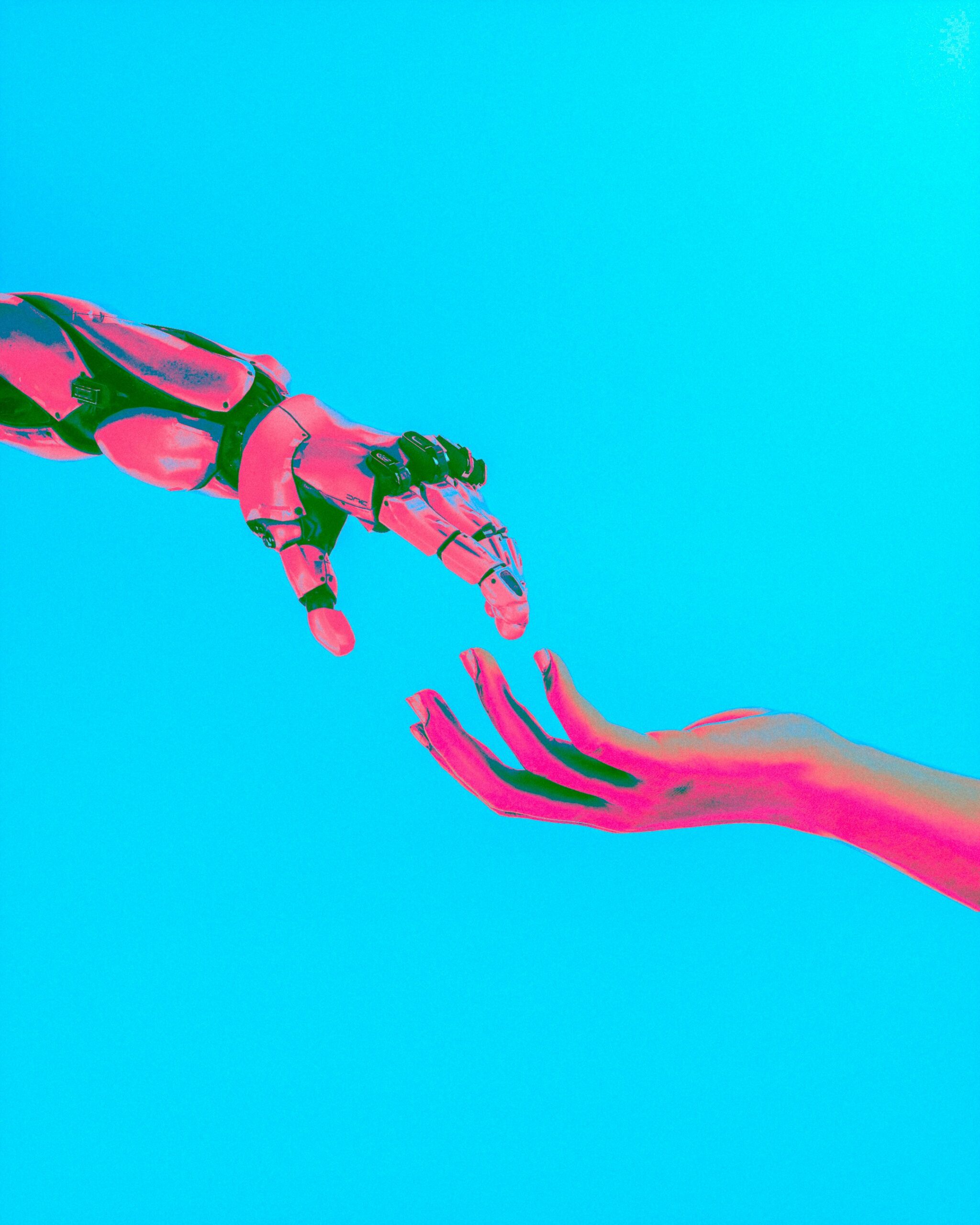 Robotic hand reaching towards a human hand against a blue background